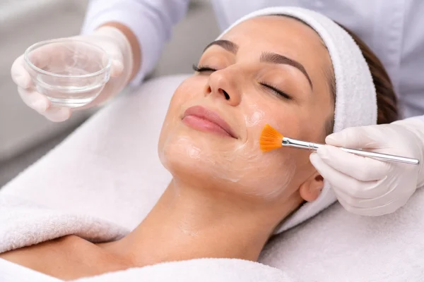 Practitioner preparing a chemical peel